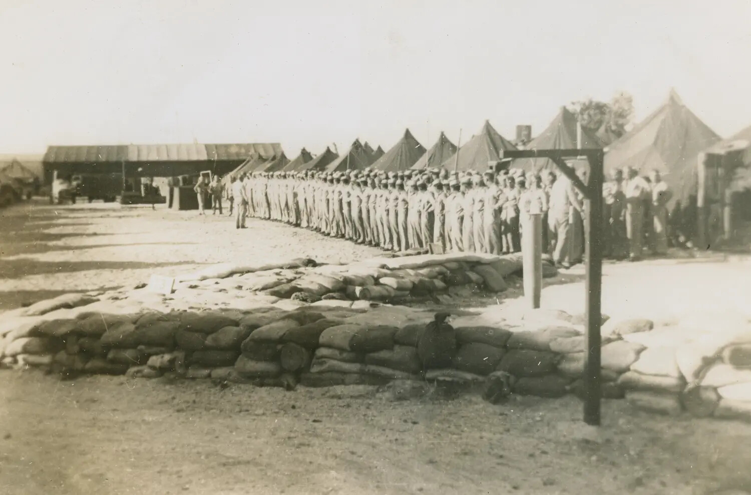 Formation Muster of Servicemen at Tent Encampment with Sandbag Revetments, Edward P. McAleer WWII Album