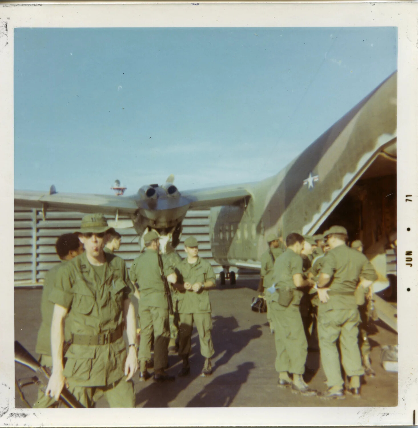 U.S. Servicemen Boarding C-7A Caribou Transport Aircraft, South Vietnam, June 1971