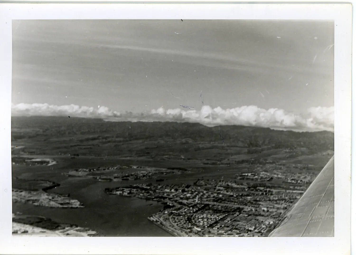 Aerial View of a Hawaiian Coastal City from an Aircraft Window