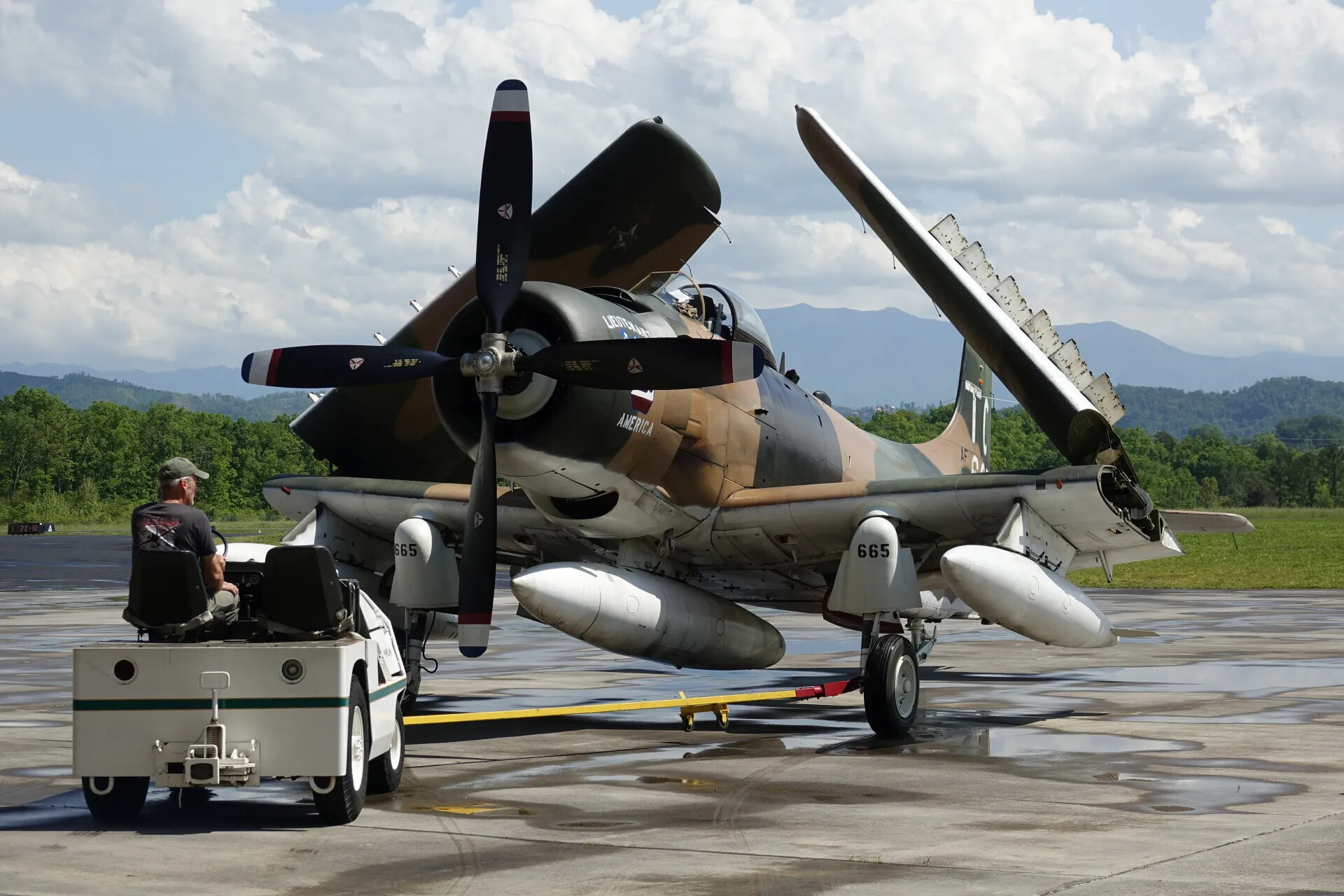 A-1 Skyraider 'AF 665' Being Towed with Wings Folded — May 2019 Fly-In Event