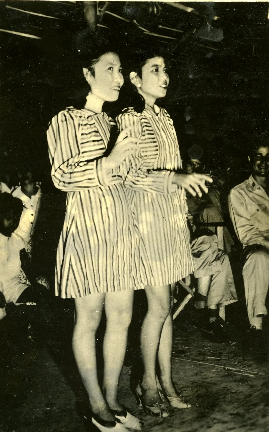 Two Female Performers on Stage in Matching Striped Dresses, Pacific Theater, WWII Era