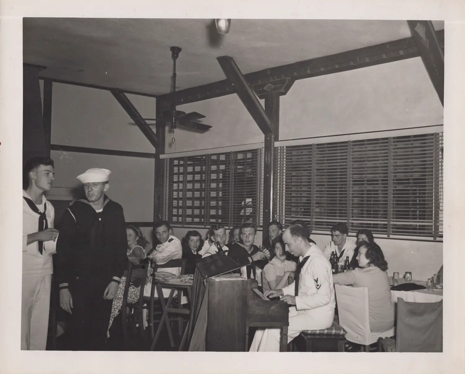 Sailors and Guests at Recreation Club Sing-Along with Piano Accompaniment, WWII Era
