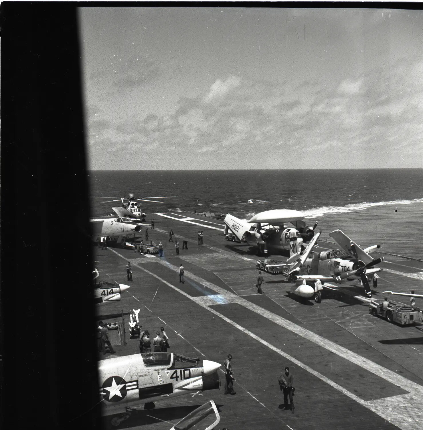 Flight Deck of USS Ticonderoga (CVA-14) with F-8 Crusaders, E-1B Tracer, and A-1 Skyraider, Vietnam War Era
