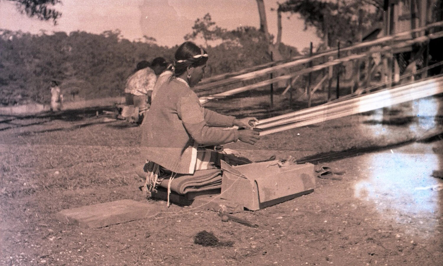 Close View of Filipino Weaver at Ground Loom, Baguio Area, Luzon, Philippines, WWII Era