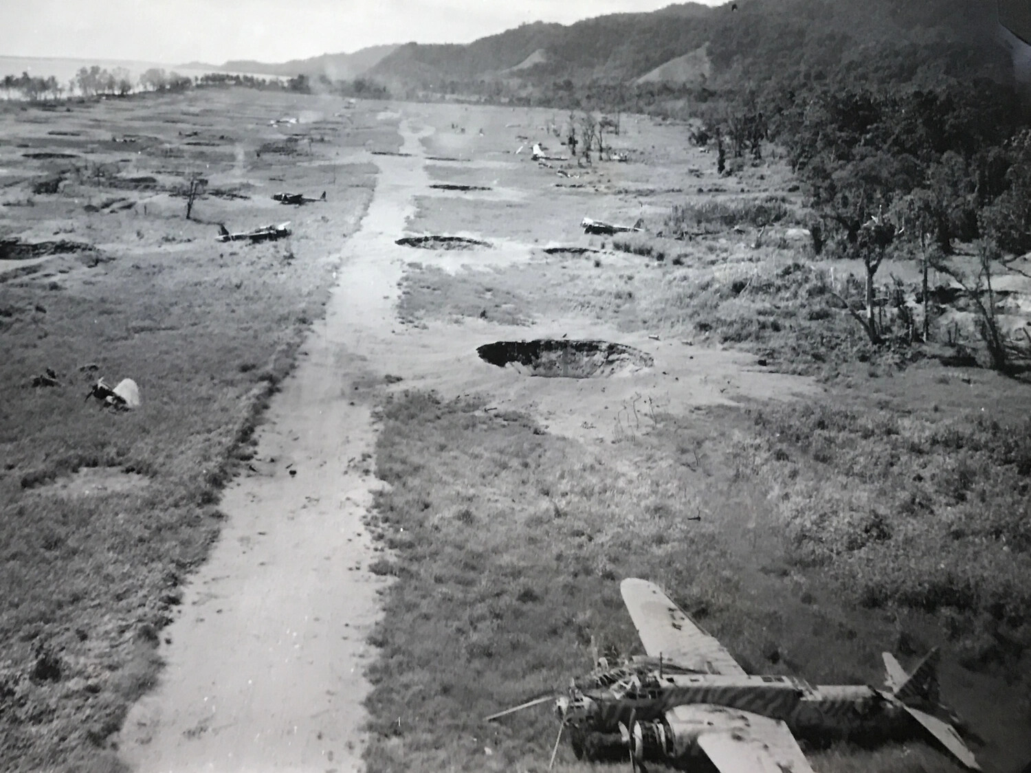 Aerial View of Bombed Japanese Airfield with Wrecked Aircraft, Southwest Pacific Theater