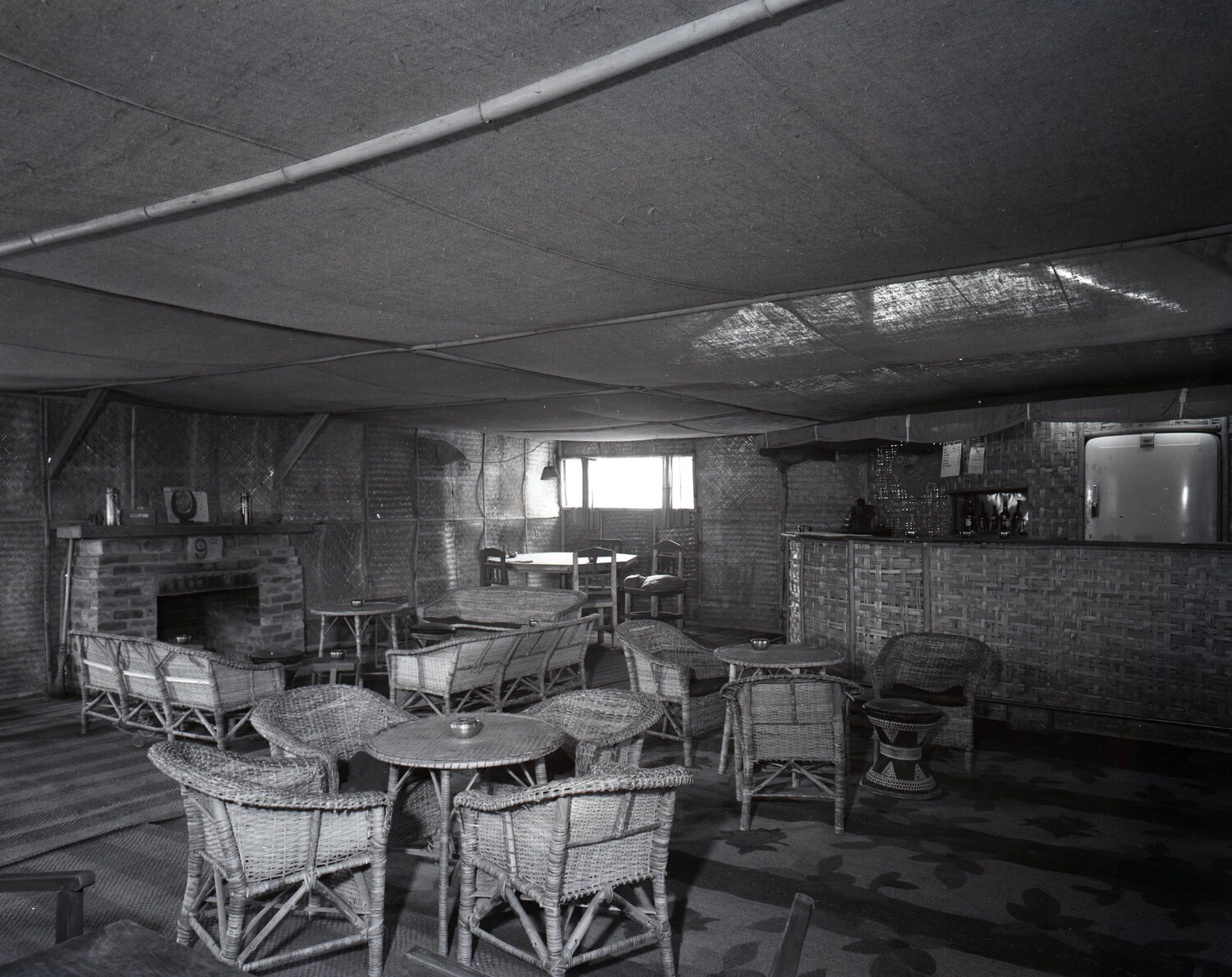 Squadron Officers' Club Interior with Bamboo Bar and Brick Fireplace, CBI Theater — Kotec Collection