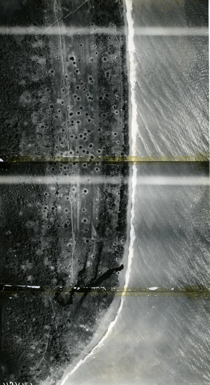 Vertical Aerial Reconnaissance Photograph of Cratered Coastline, 312th Bomb Group, WWII Pacific Theater