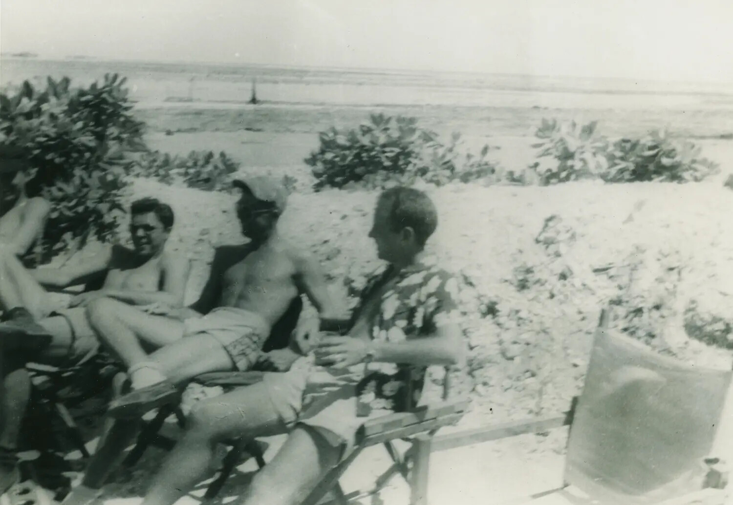 Group of Men Relaxing on a Beach, McAleer Personal Photo Album