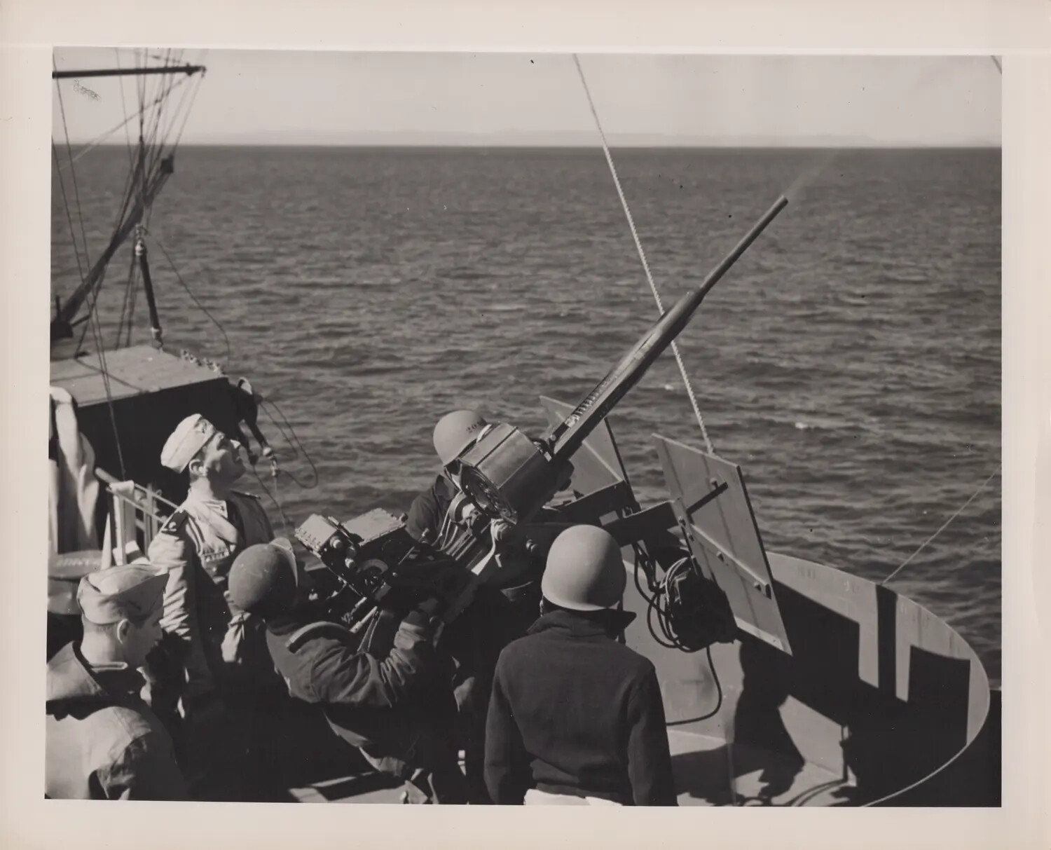 US Navy Gun Crew at a 20mm Anti-Aircraft Mount Aboard an Unidentified Vessel, WWII Era