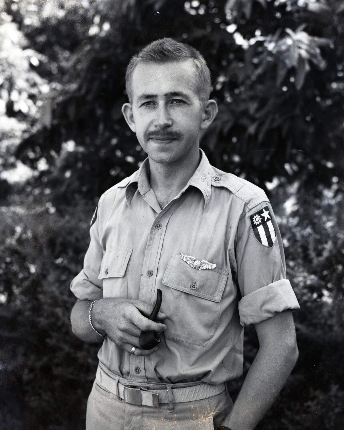 Portrait of U.S. Army Air Forces Airman with CBI Theater Patch and Aircrew Wings