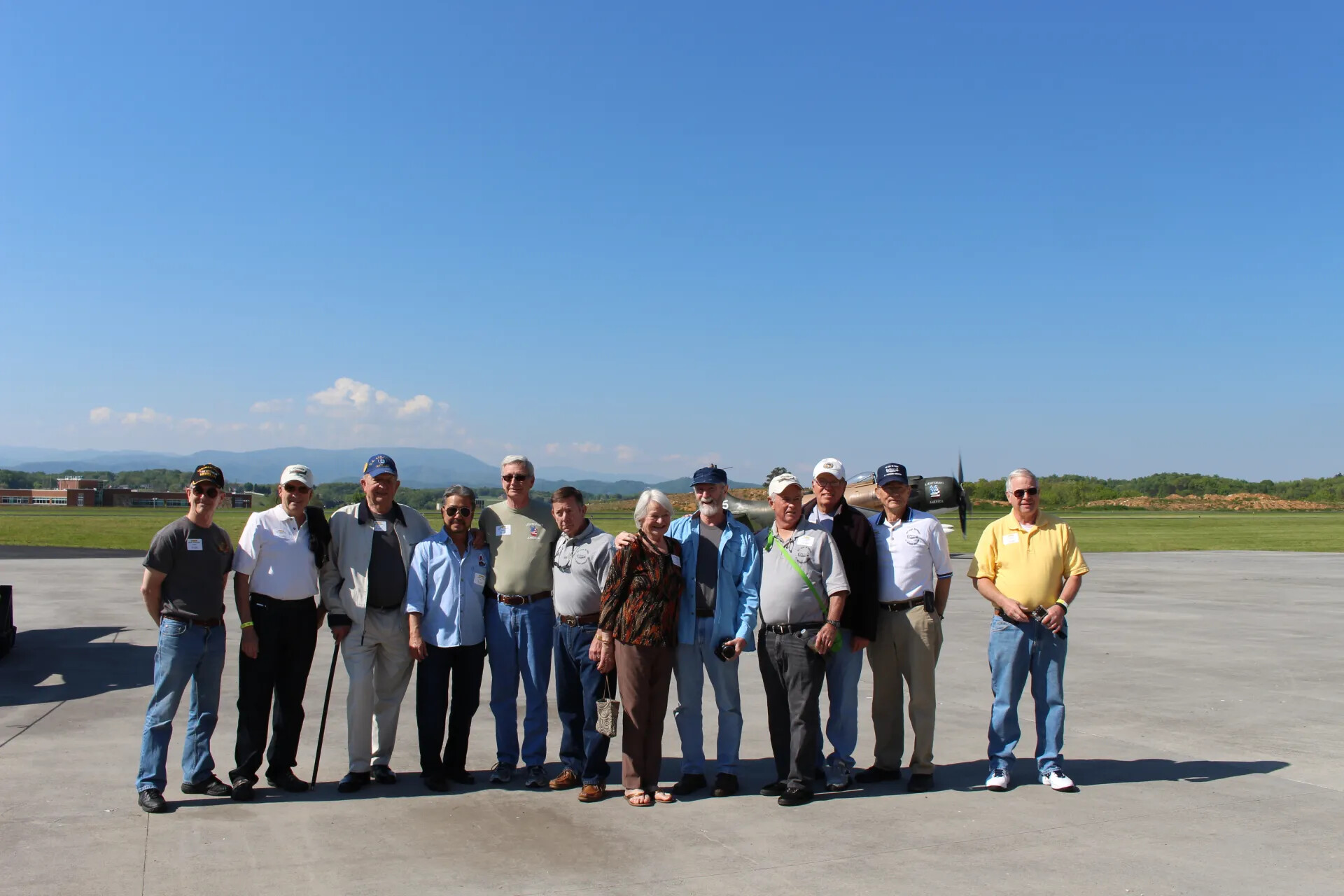 Wide Group Portrait with A-1 Skyraider "Lieutenant America" in Background