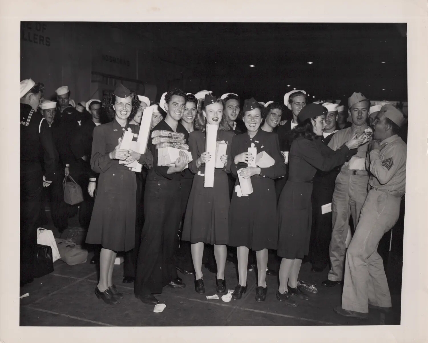 U.S. Navy WAVES and Sailors at a Wartime Reception, World War II