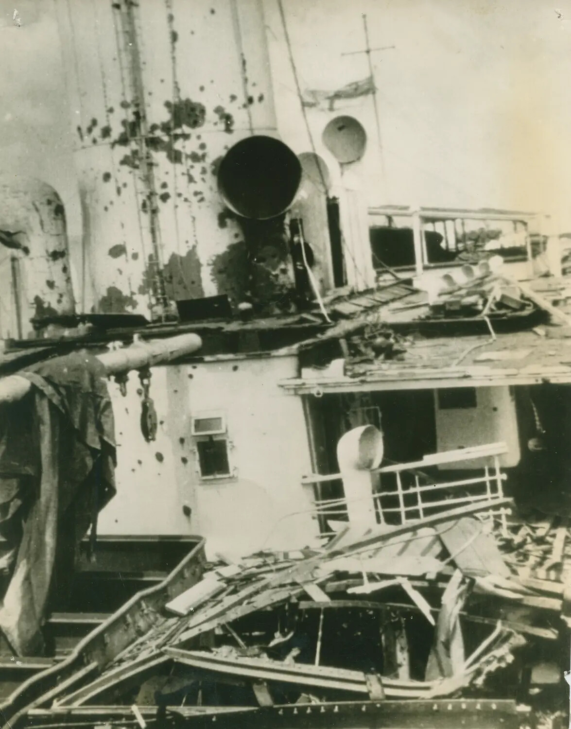 Bomb-Damaged Ship Superstructure Showing Shrapnel Scarring and Collapsed Deck Structure, WWII