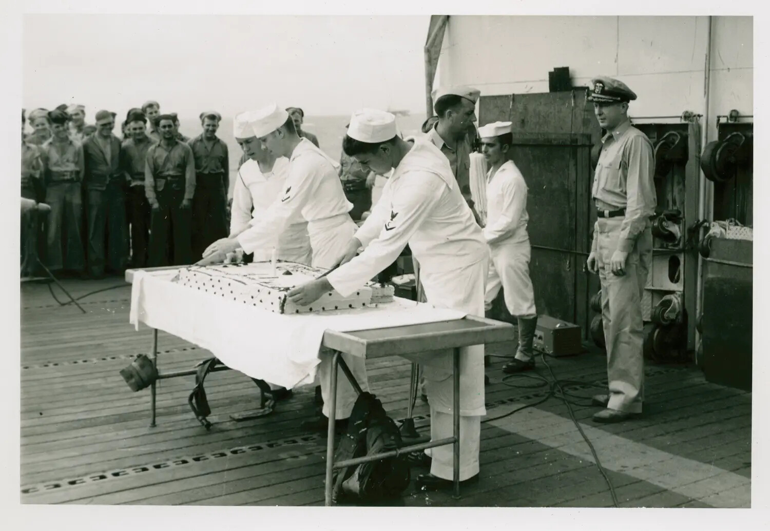Cake-Cutting Ceremony on Deck, USS Petrof Bay (CVE-80)