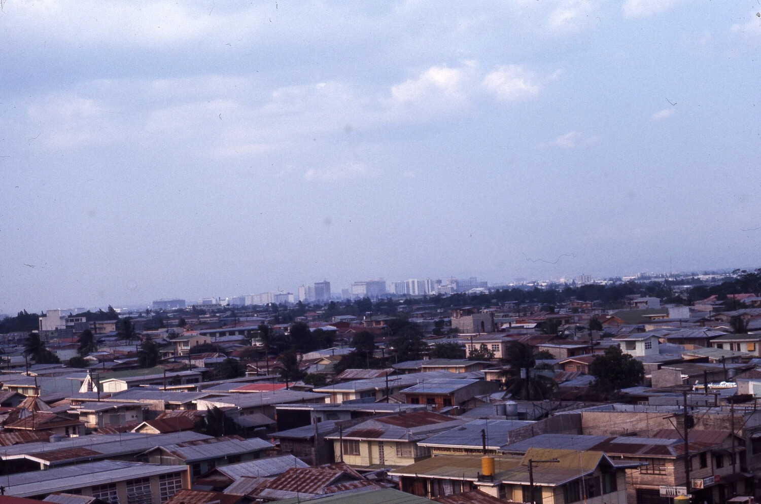 Elevated Cityscape View of Philippine Urban Neighborhood with Distant Skyline, Vietnam War Era
