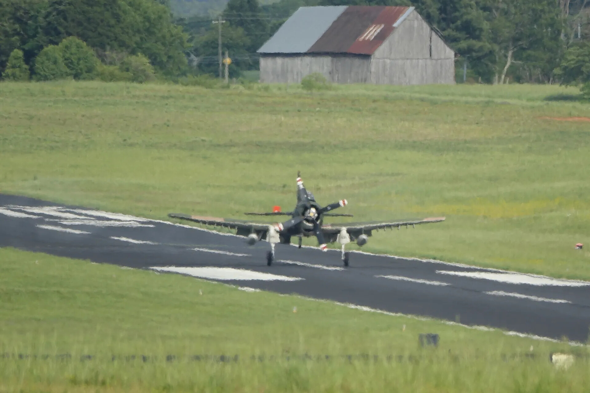 F4U Corsair Taxiing on Rural Airstrip