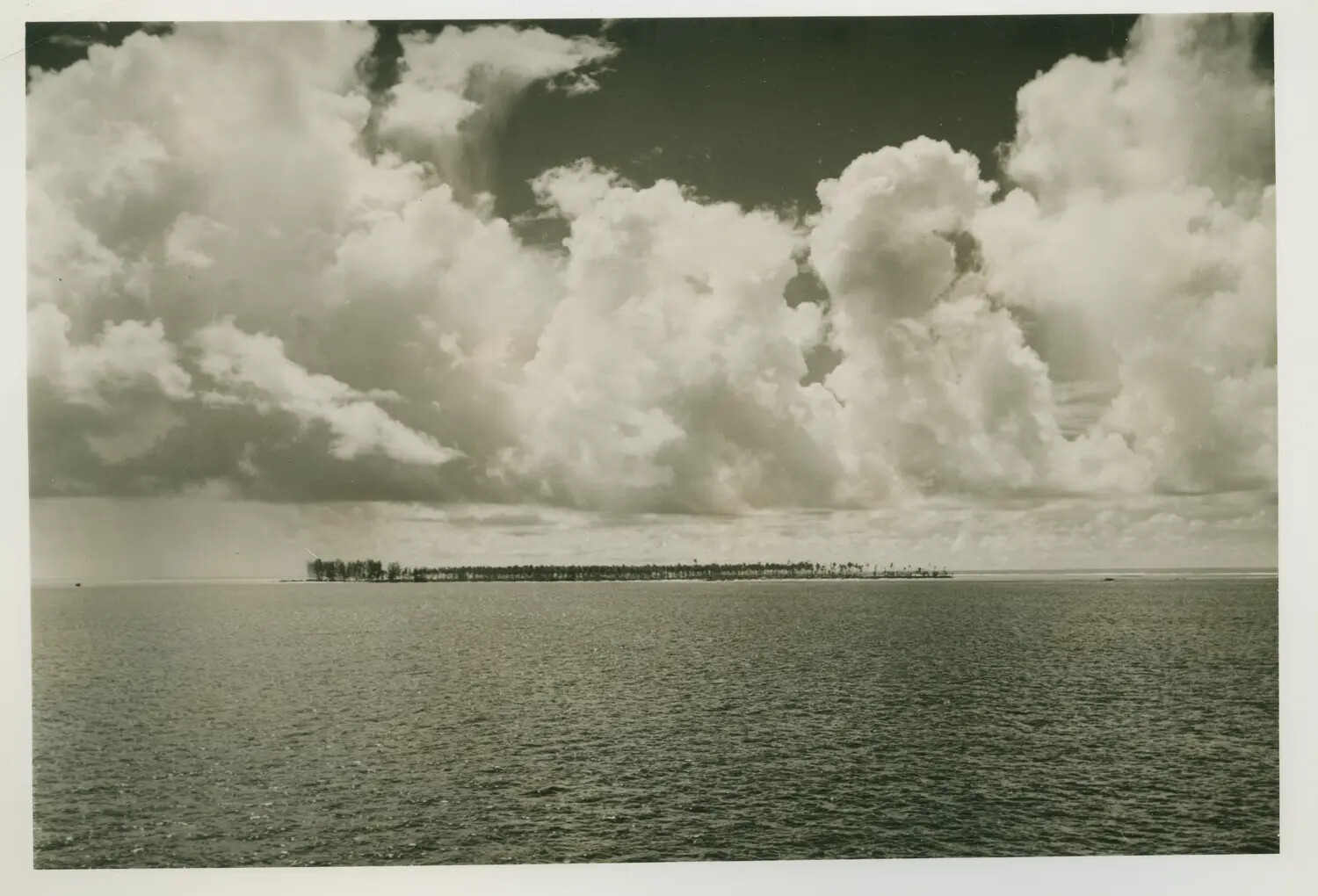 Tropical Atoll on the Horizon with Cumulus Clouds, USS Petrof Bay (CVE-80) Collection