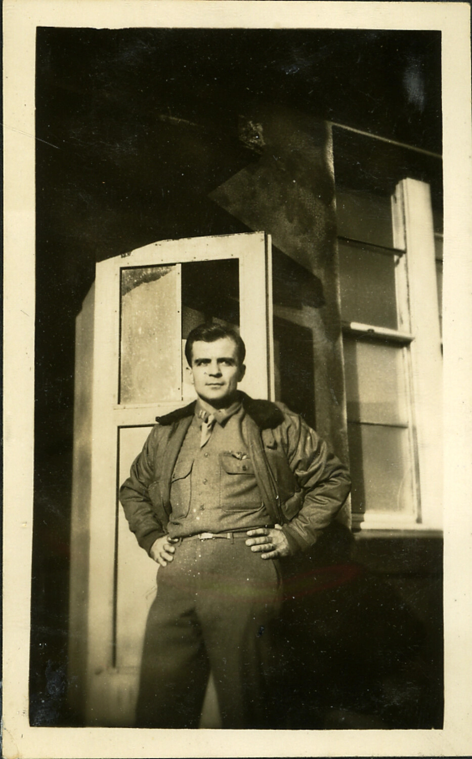 Portrait of an Airman in Flight Jacket Outside Barracks Quarters, Postwar Japan