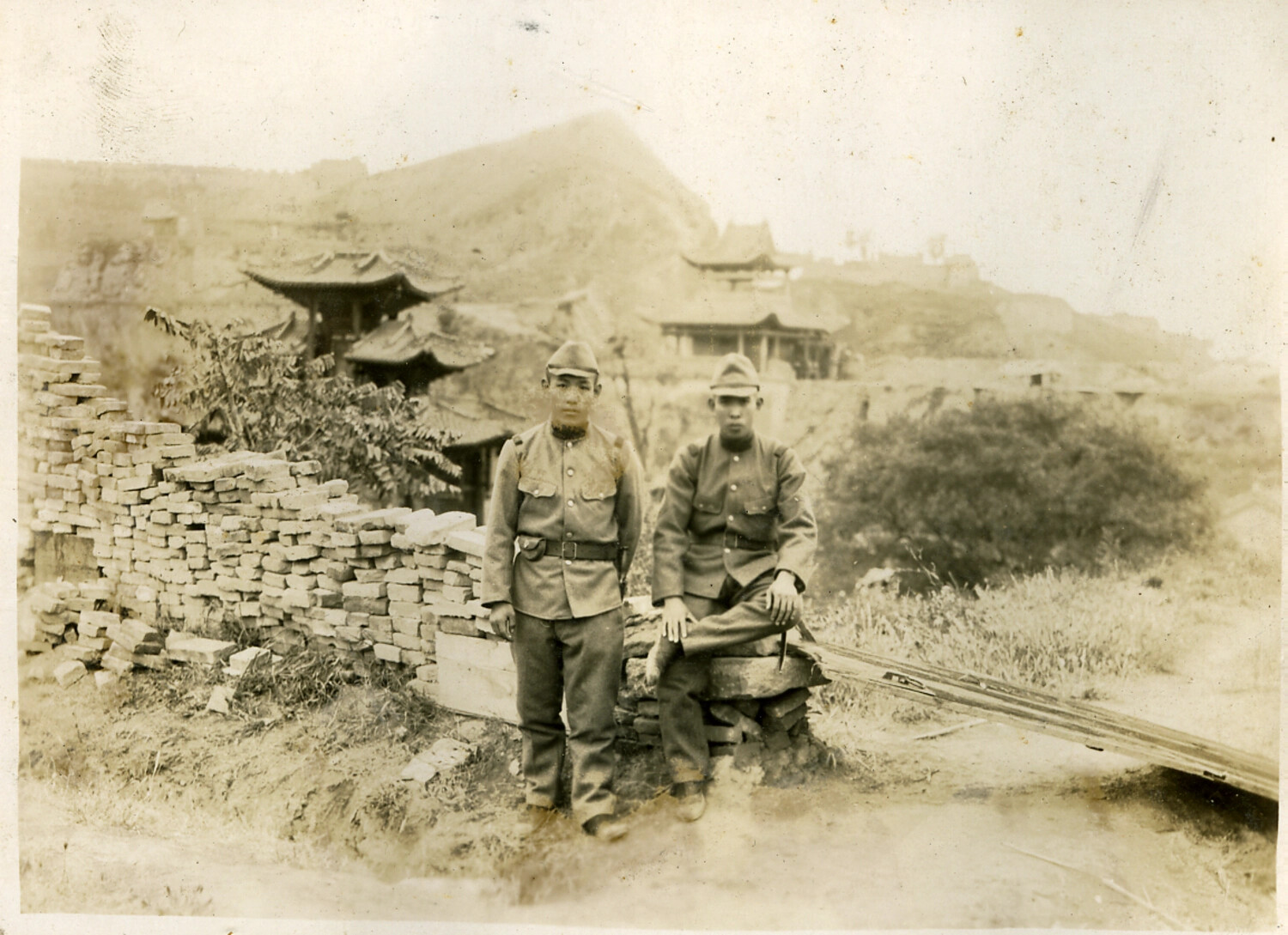 Japanese Soldiers Beside Salvaged Brick Piles Near a Chinese Temple Complex