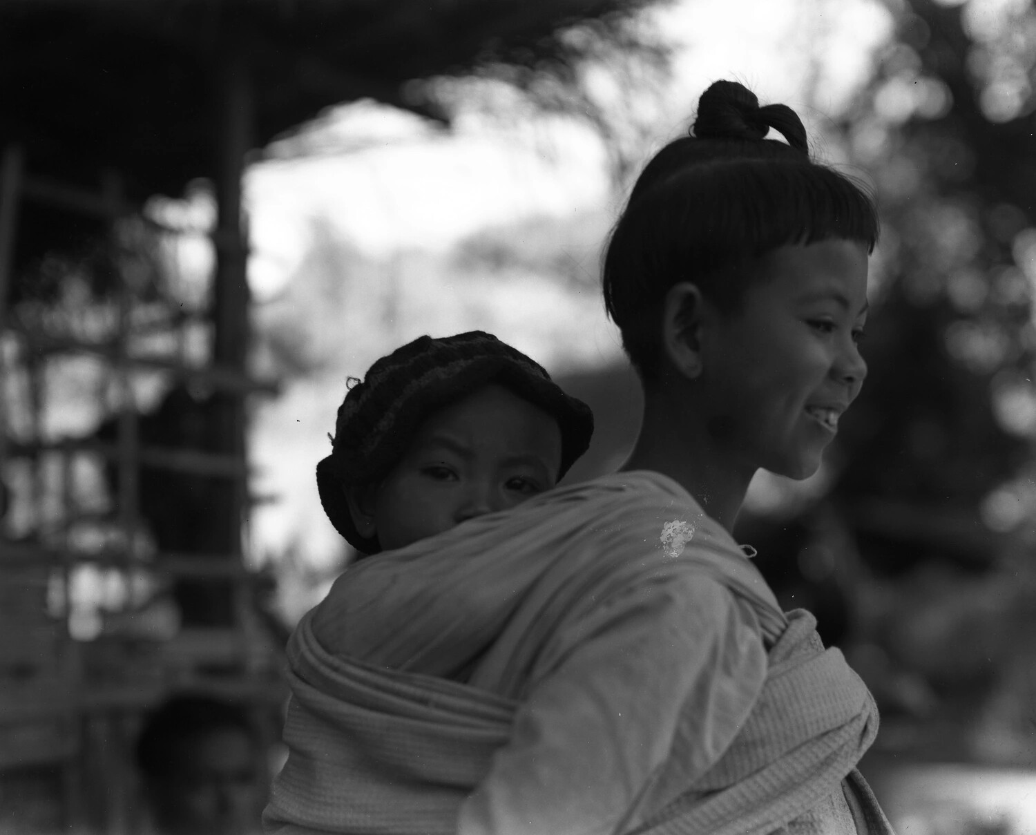 Young Girl Carrying Infant in Back-Sling, Myitkyina Region, Burma, WWII Era
