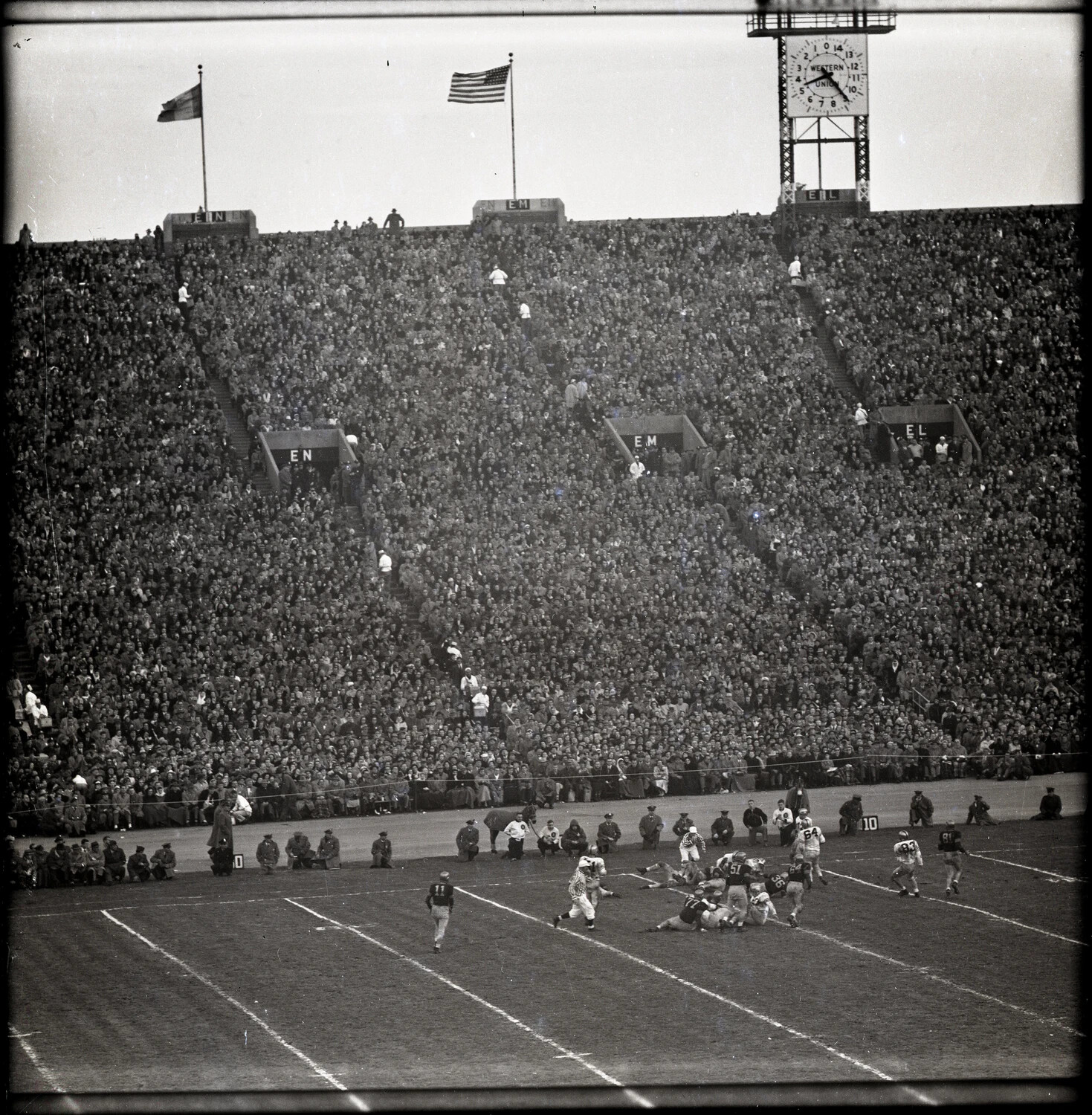 Army-Navy Football Game - Run Play with Western Union Clock Tower, Municipal Stadium