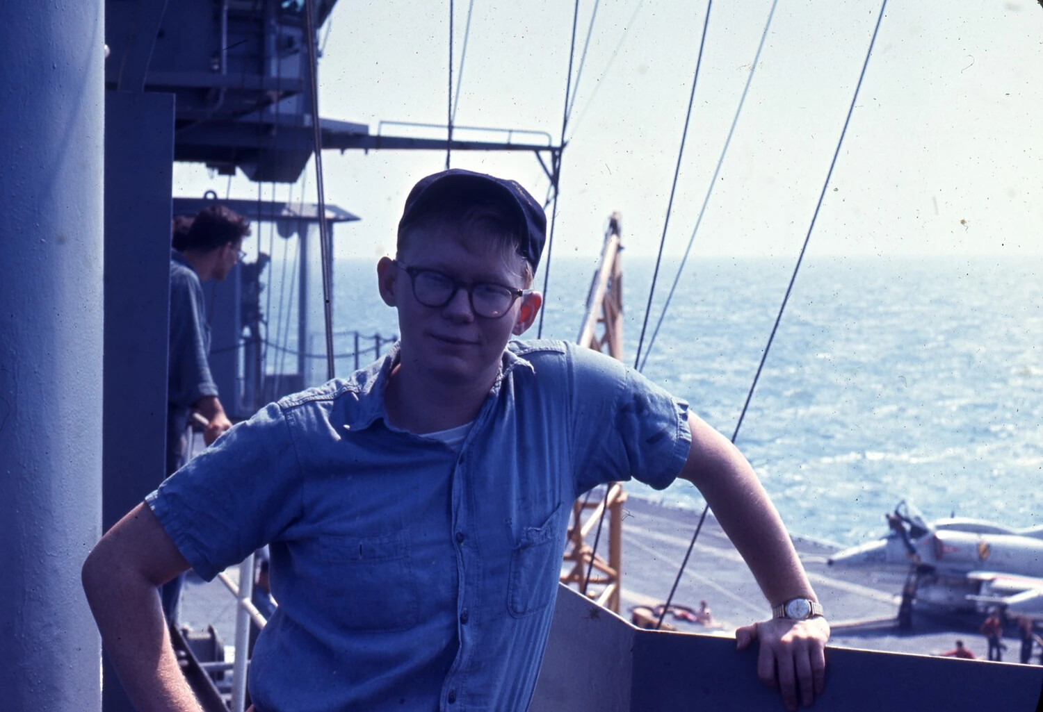 Sailor Portrait on Island Superstructure with Aircraft Below, USS Ticonderoga, Vietnam War Era