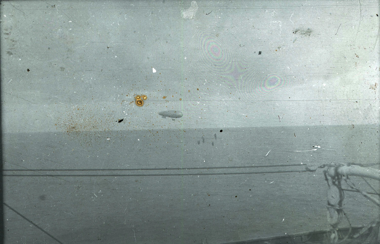 WWI France Glass Plate Negative No. 12 — Airship/Blimp Over Water, Viewed from Ship's Deck
