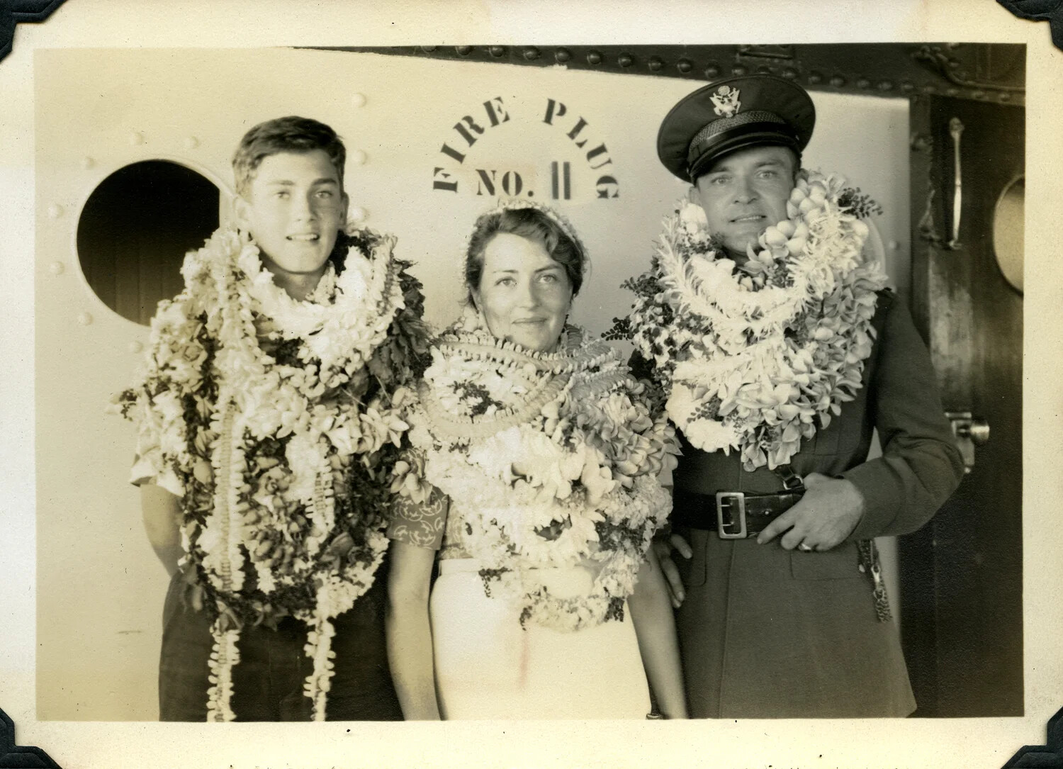 Family with Hawaiian Leis Aboard Ship, Jervey Signal Corps Album