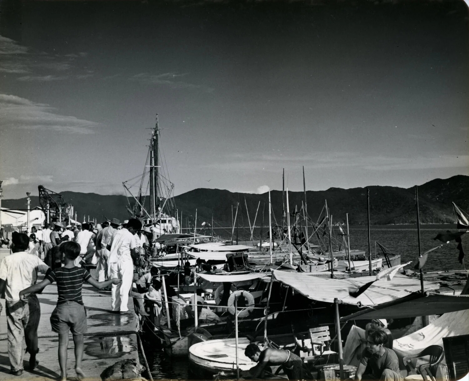 Pier and Fishing Fleet with Pedestrians, Mexican Harbor, 1949