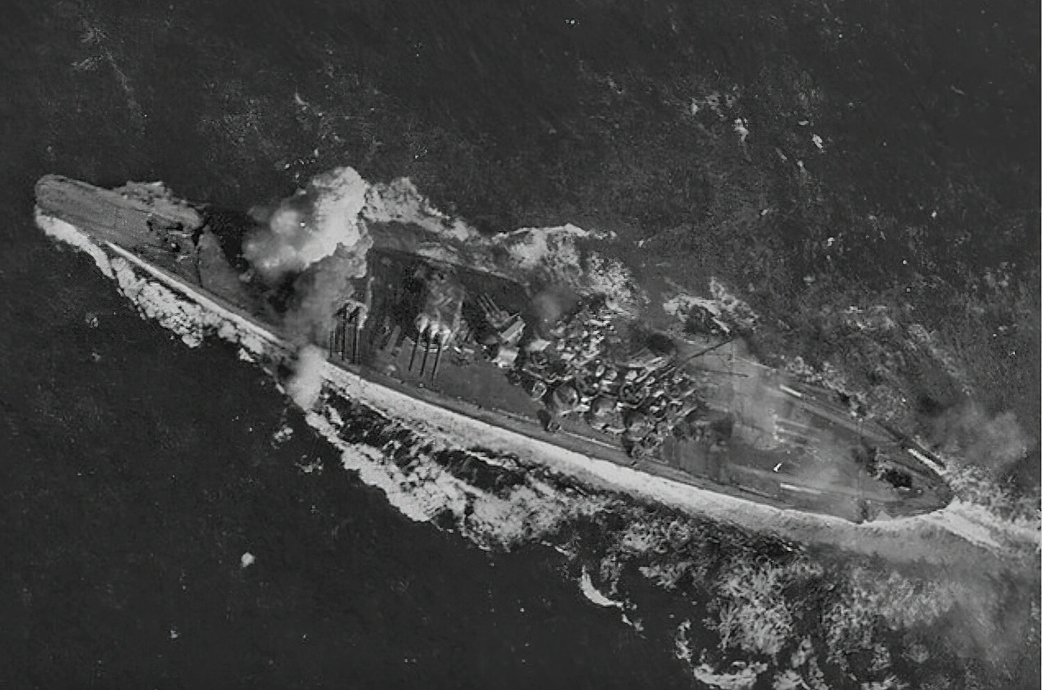 Aerial View of a Japanese Warship Under Attack and Sinking