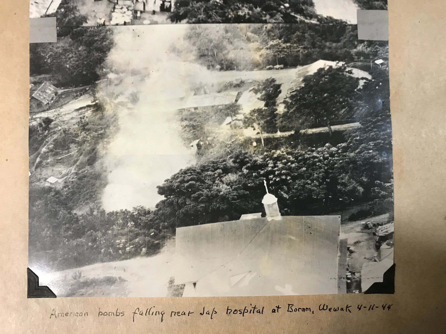 Album-Mounted Photograph: 'American Bombs Falling Near Jap Hospital at Boram, Wewak,' 11 April 1944
