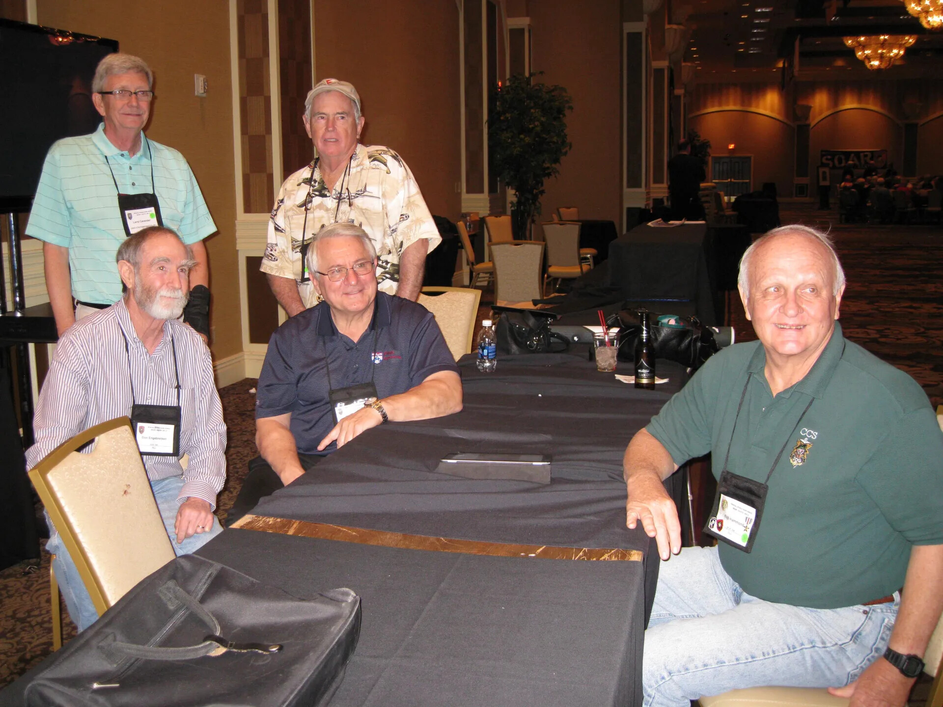 Five Attendees at a Banquet Table with the SOAR Event Banner Beyond, Special Operations Association Reunion XXXVII, Las Vegas, 2013