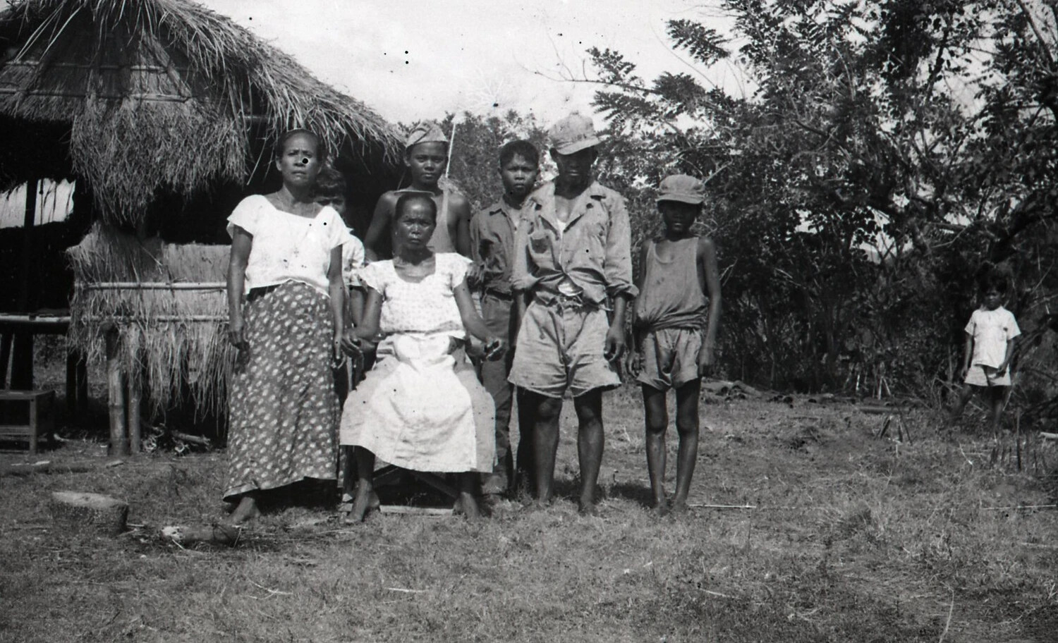 Filipino Family Group Portrait in Front of Nipa Hut, Luzon, Philippines, WWII Era