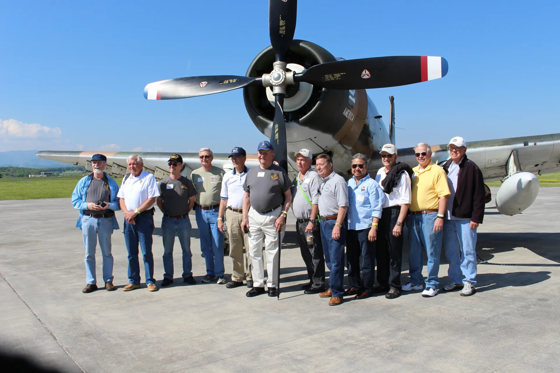 Group Portrait Beneath A-1 Skyraider Propeller (Closer Frame)