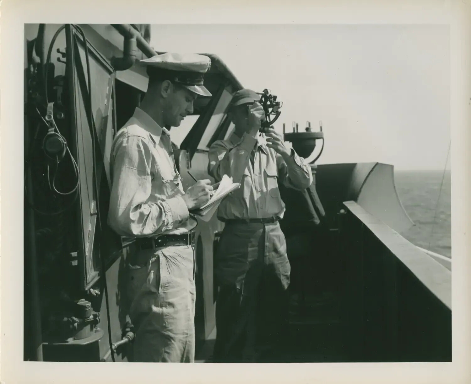 Navigation Officers Taking a Sextant Sighting Aboard USS Petrof Bay (CVE-80)
