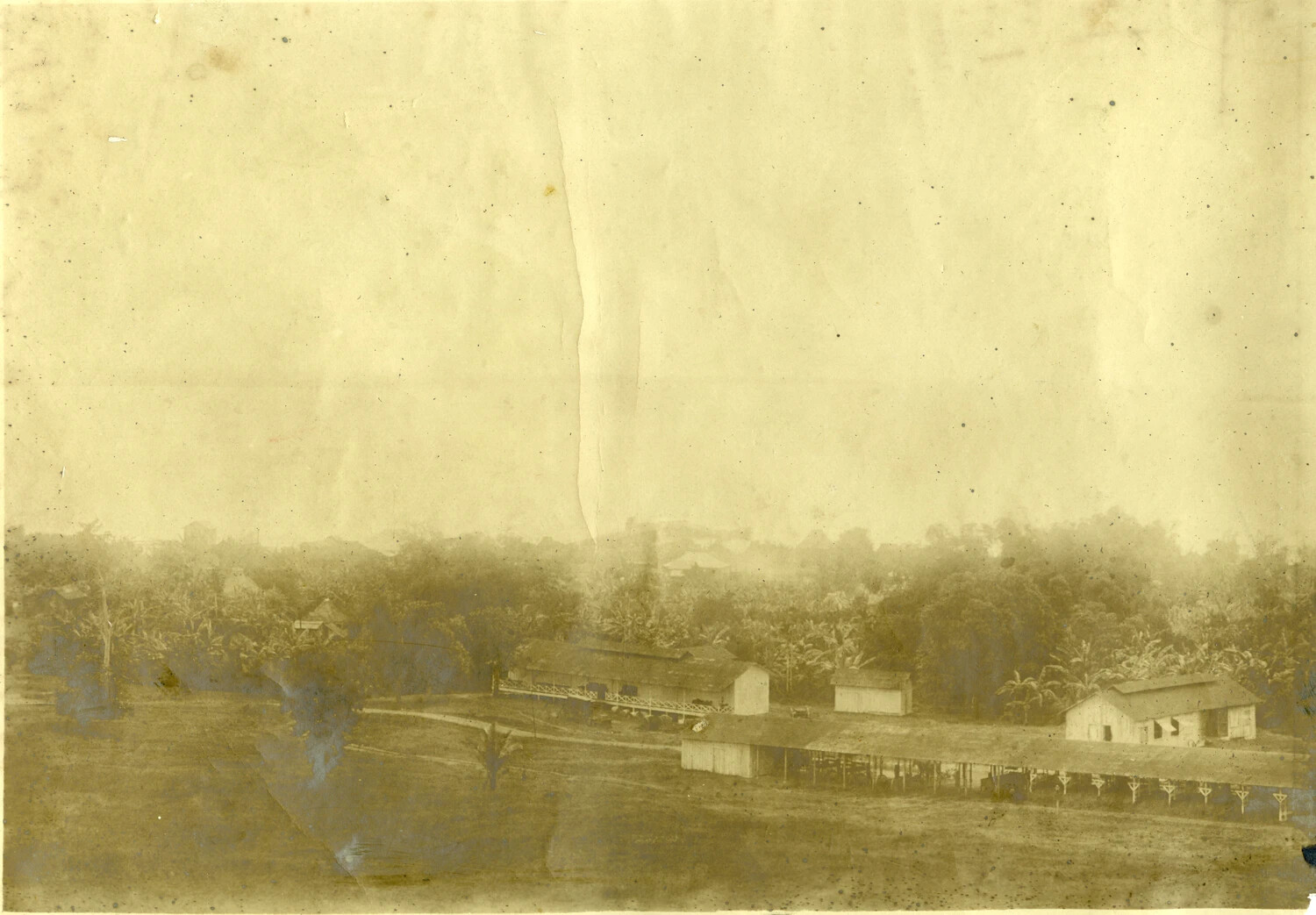 Distant View of Wooden Compound Buildings, Philippines, Early 1900s – Carl Stone Album