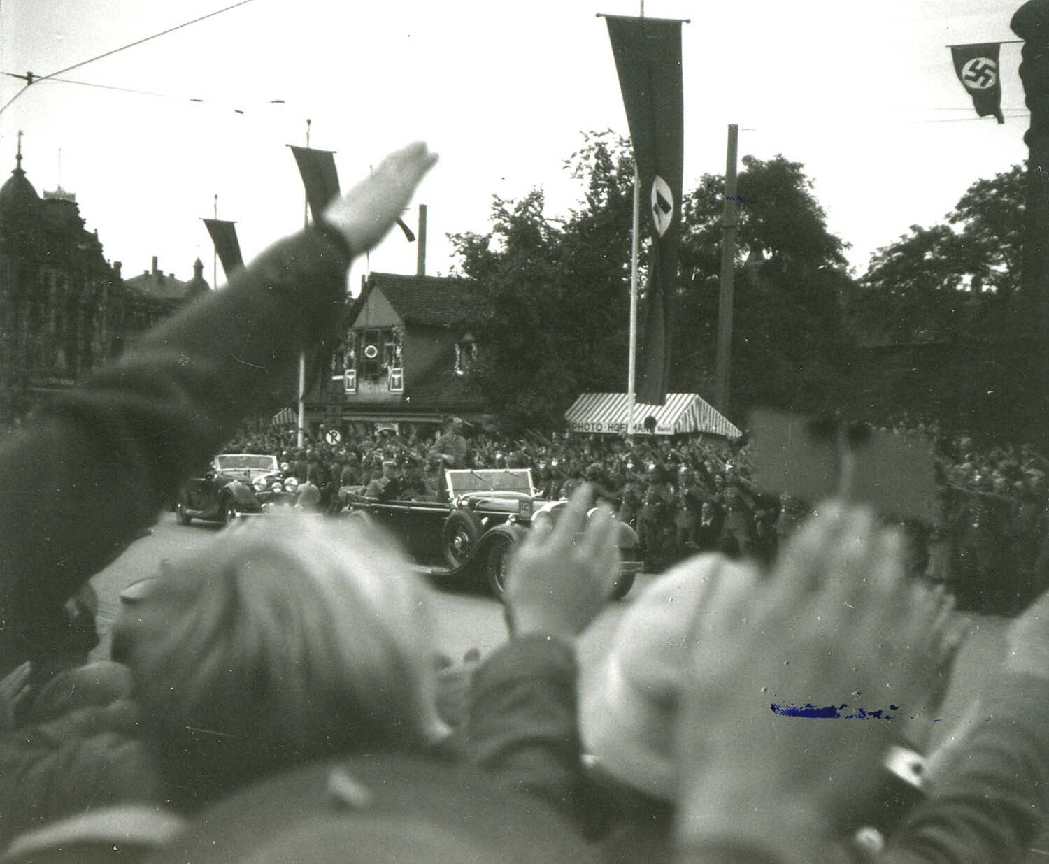 Crowd Salutes Nazi Party Motorcade with 'Photo Hoffmann' Booth Visible, Pre-WWII Germany