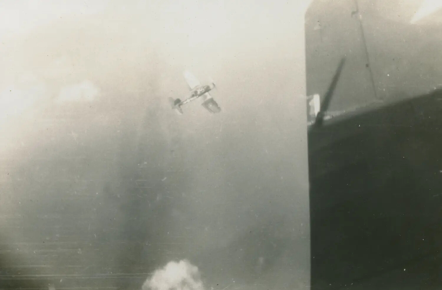 Aircraft in Steep Dive Near U.S. Navy Ship During Combat, Pacific Theater, WWII (McAleer Album)