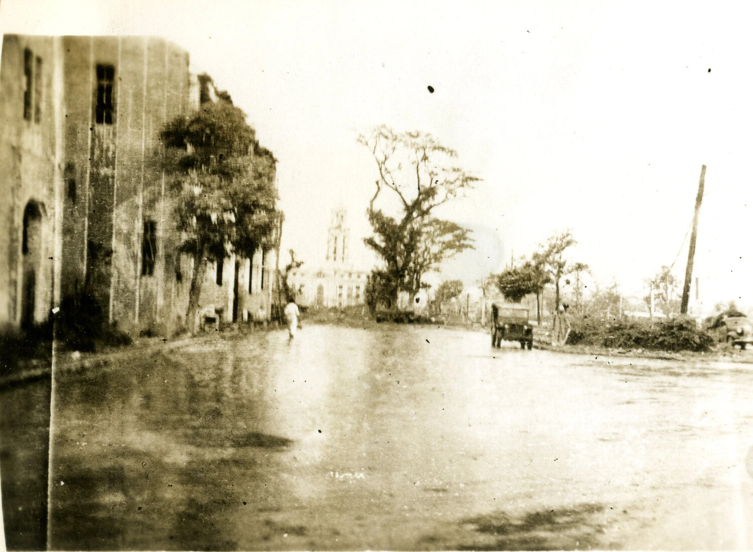 War-Damaged Street with U.S. Army Jeep, Pacific Theater -- 345th Bomber Group Album