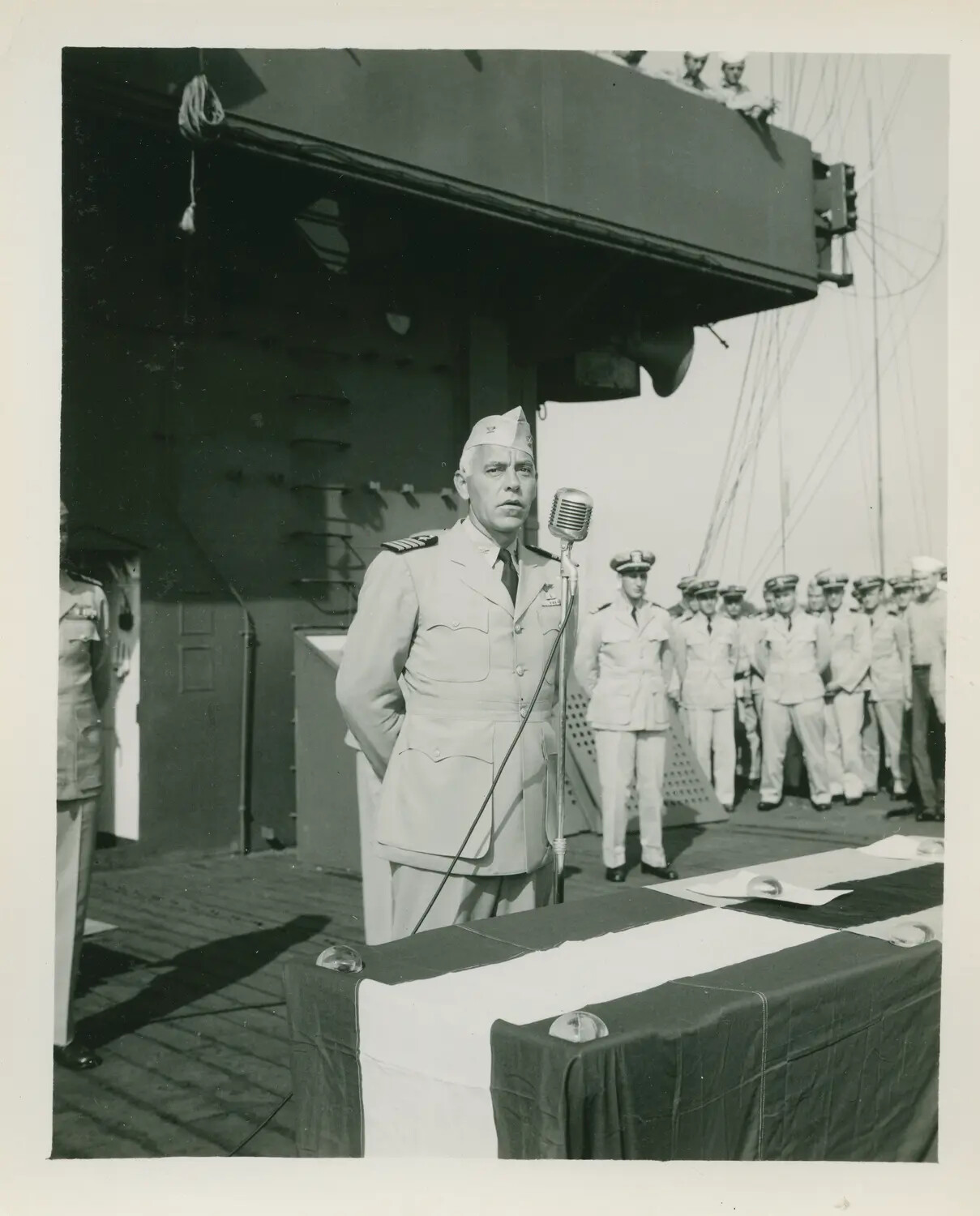 Formal Ceremony Aboard USS Petrof Bay (CVE-80) - Officer Addressing Assembled Crew