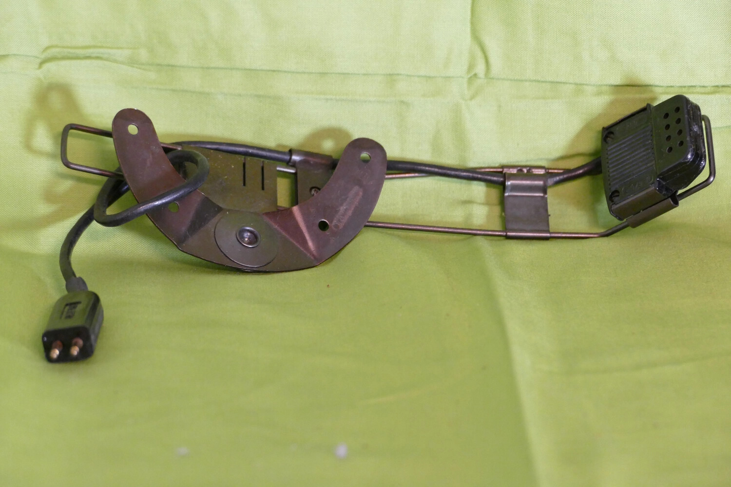 Artifact Photograph: Helmet Microphone Bracket and Wiring Assembly, Korean War Era