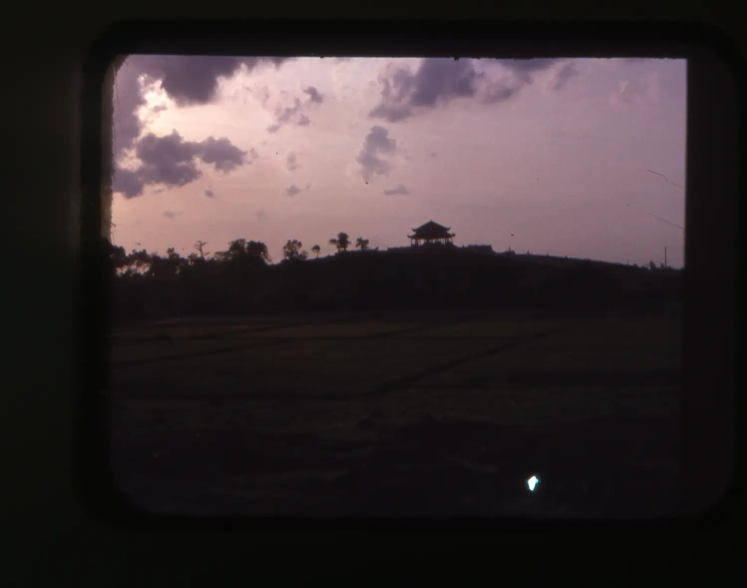 Pagoda Silhouette at Dusk over Rice Paddies, Near Cam Ranh Bay, Vietnam