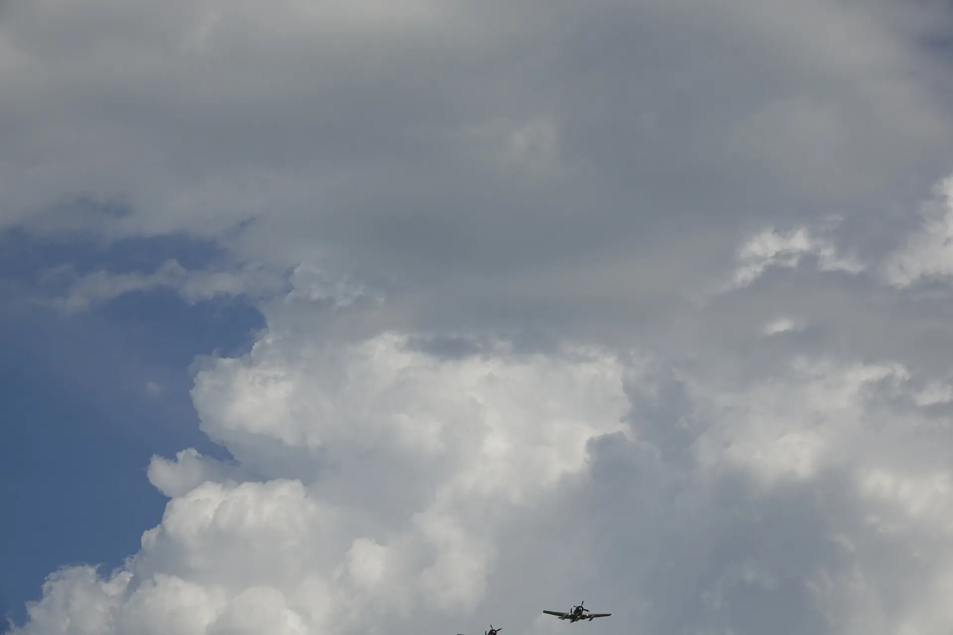 Vintage Warbird Aircraft Climbing Through Cloud Formation, Commemorative Event