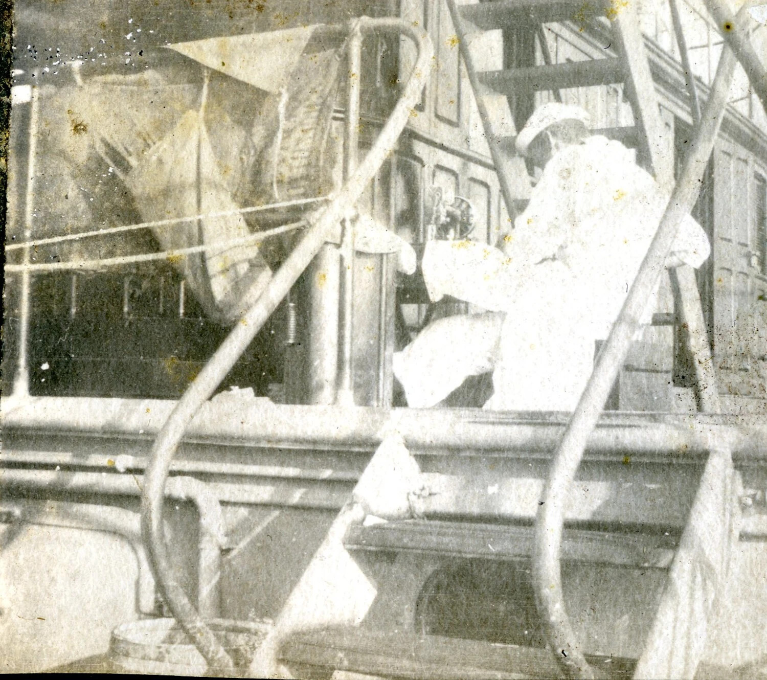 Sailor at Work on Ship's Equipment Amid Rigging Lines, USS Columbia, c. 1898-1910