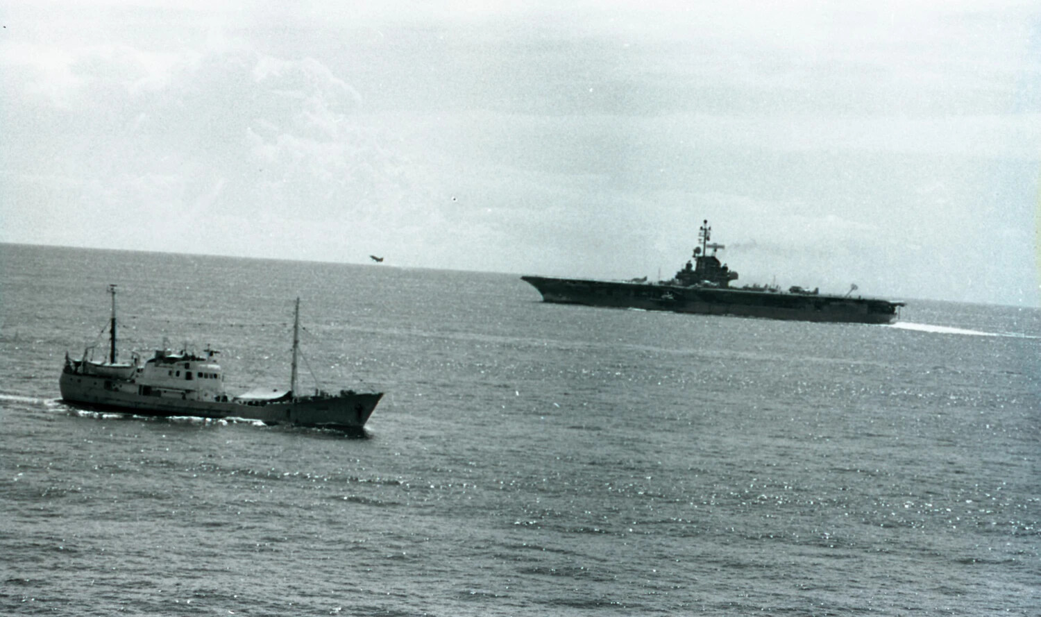 USS Ticonderoga Underway with Aircraft Airborne, Shadowed by Trawler, Vietnam War Era
