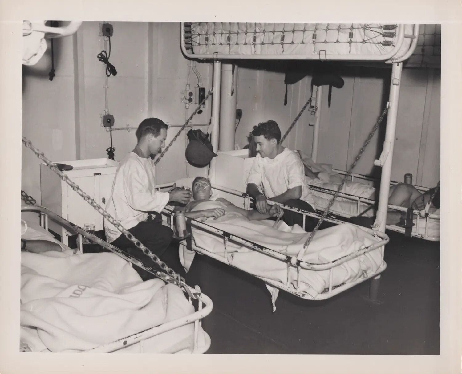 U.S. Navy Shipboard Sick Bay Scene with Injured Sailor, WWII Era