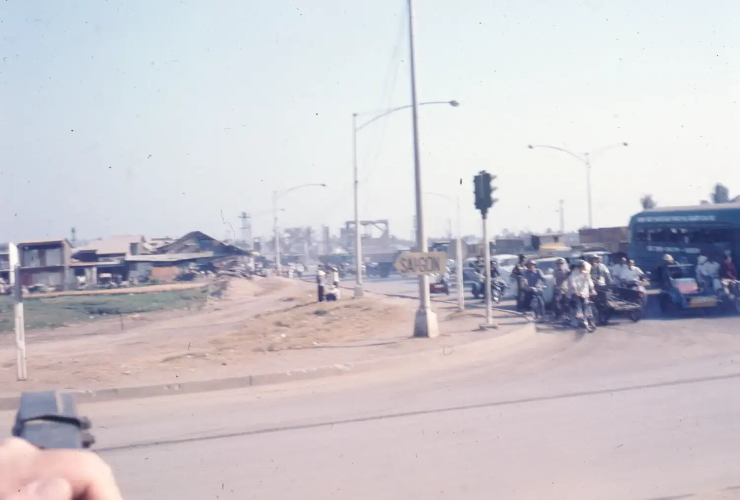 Roadway Approach to Saigon with Directional Sign and Civilian Traffic, South Vietnam, 1968 Tet Offensive Period