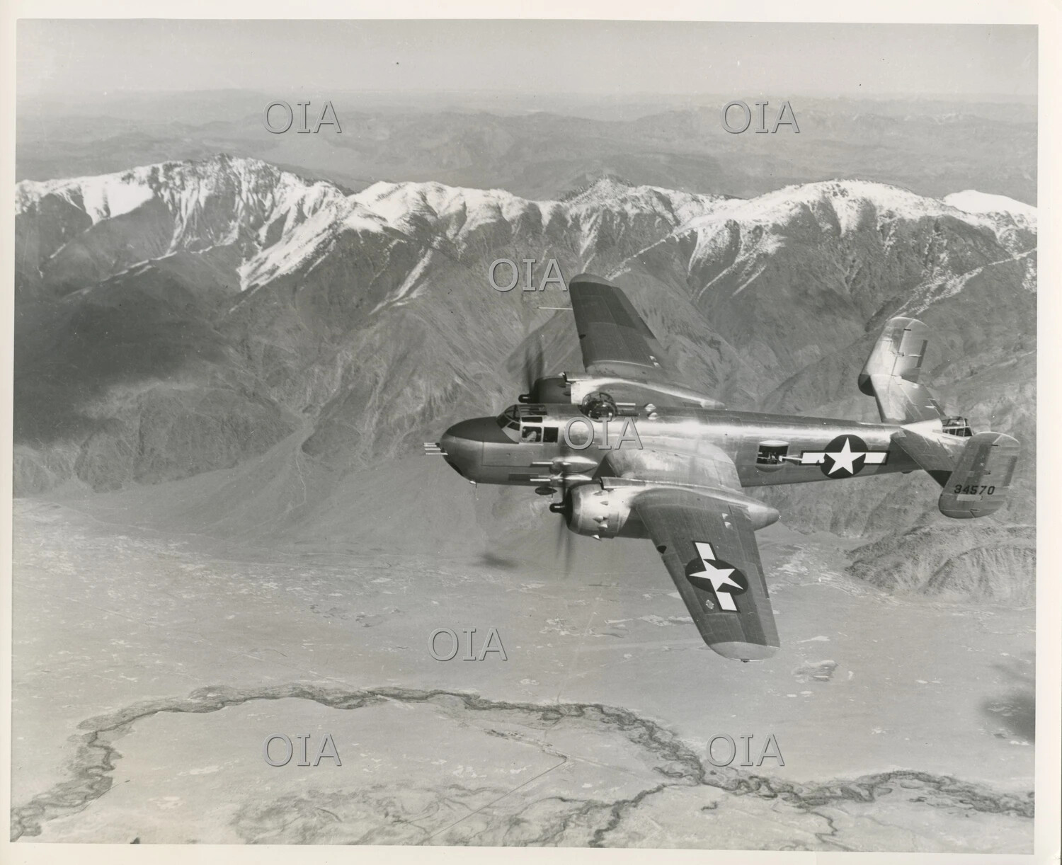 North American B-25 Mitchell Medium Bomber in Flight Over Mountainous Terrain