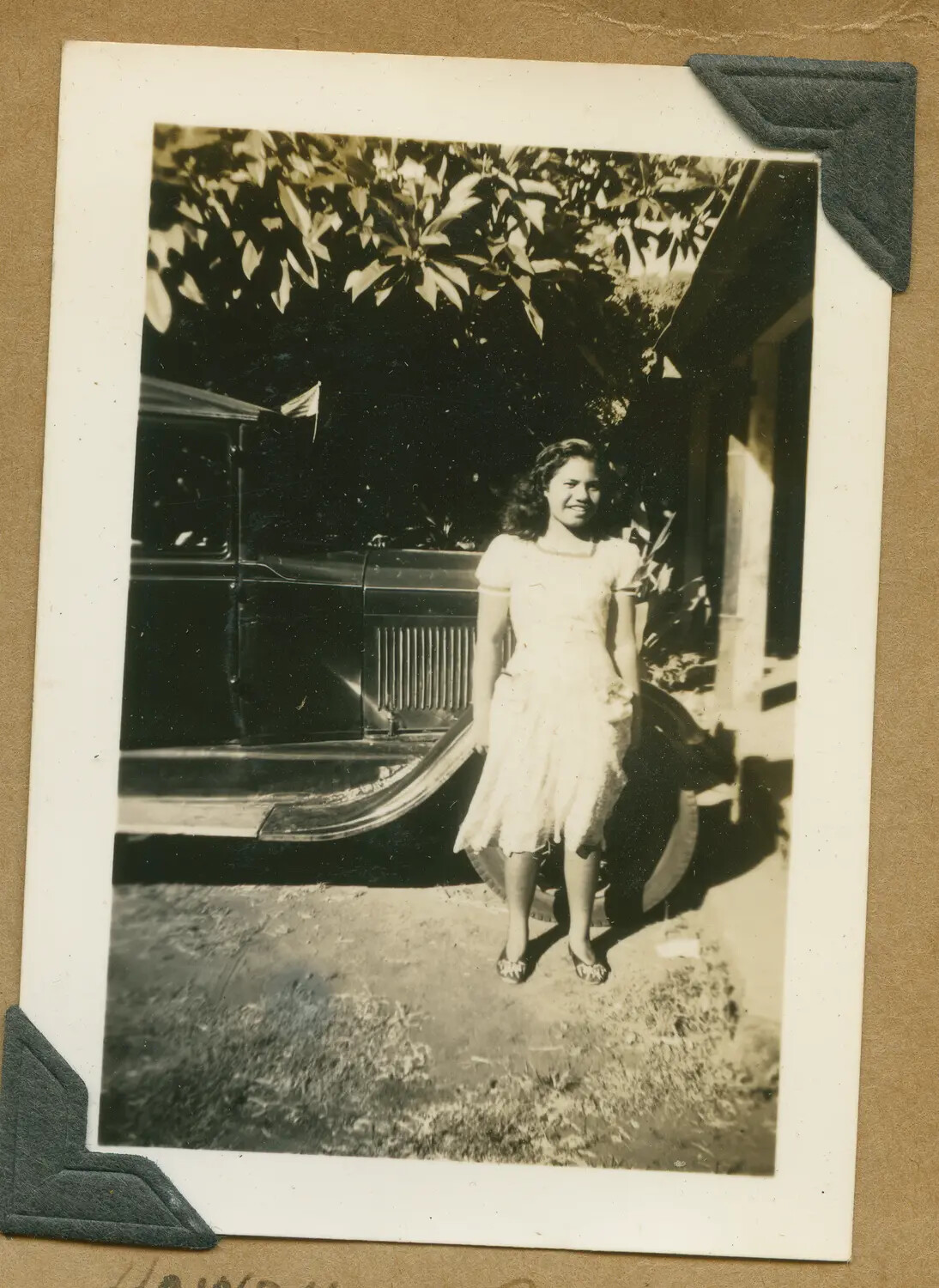 Young Woman Beside a Vintage Ford Automobile, Hawaiian Residence -- WWII-Era Family Snapshot