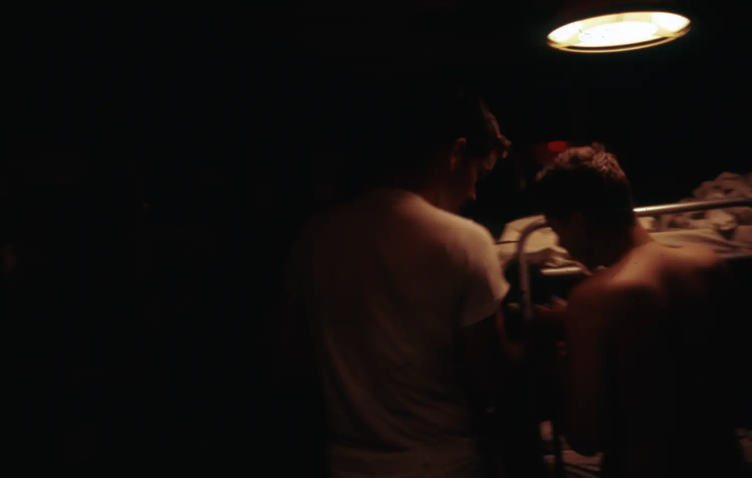Sailors in Darkened Berthing Compartment, Nighttime Candid